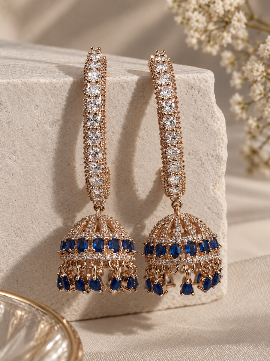 Blue Stone Jhumkas with deep blue stones, clear accents and gold-tone detailing by Ziwara House