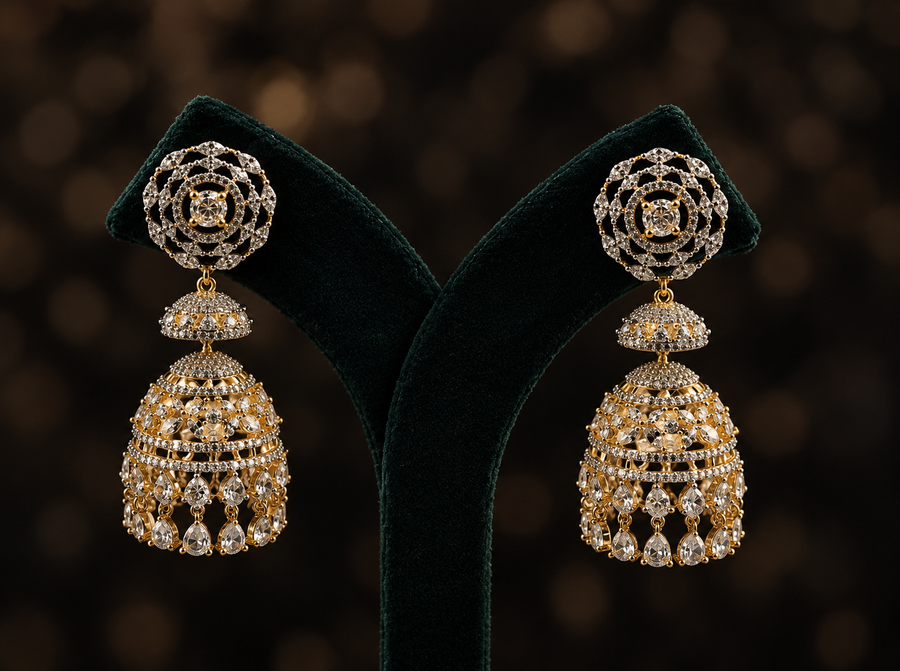 Zircon Sitara Jhumkas with layered domes, circular motifs, clear stones and teardrop accents by Ziwara House